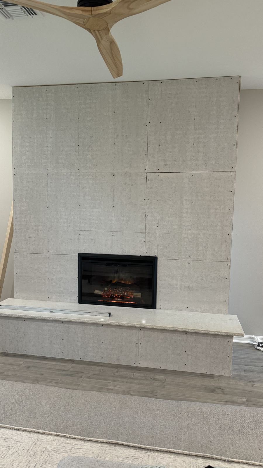 Custom fireplace finish panel installation