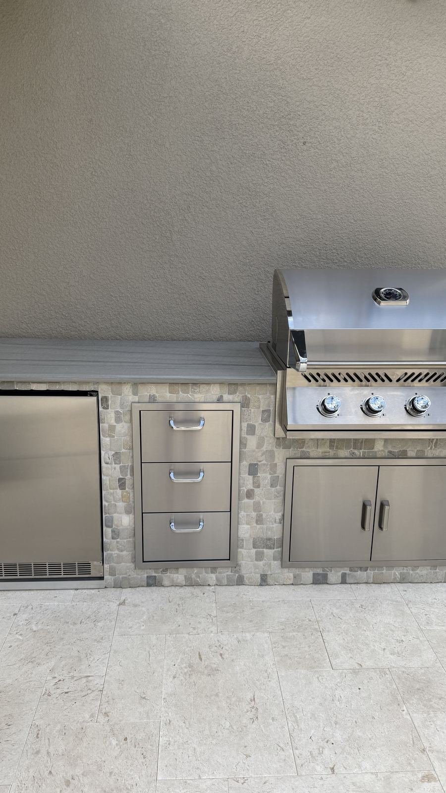 Outdoor grill and stone kitchen detail